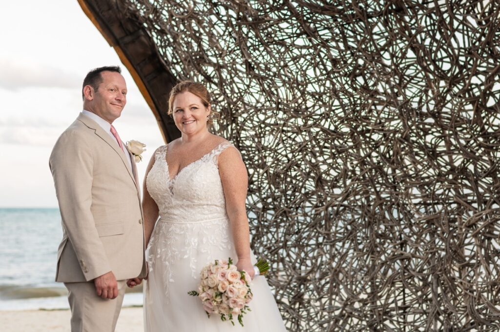 Bride and groom portraits on the beach at Dreams Natura Resort & Spa Wedding