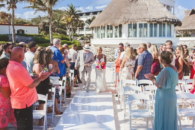 Bride and groom walking down the aisle at Hard Rock Hotel Riviera Maya Destination wedding