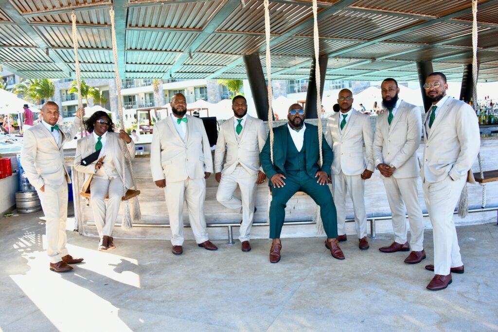 The destination wedding bridal party on the steps at Dreams Natura Resort & Spa in Riviera Cancun, Mexico