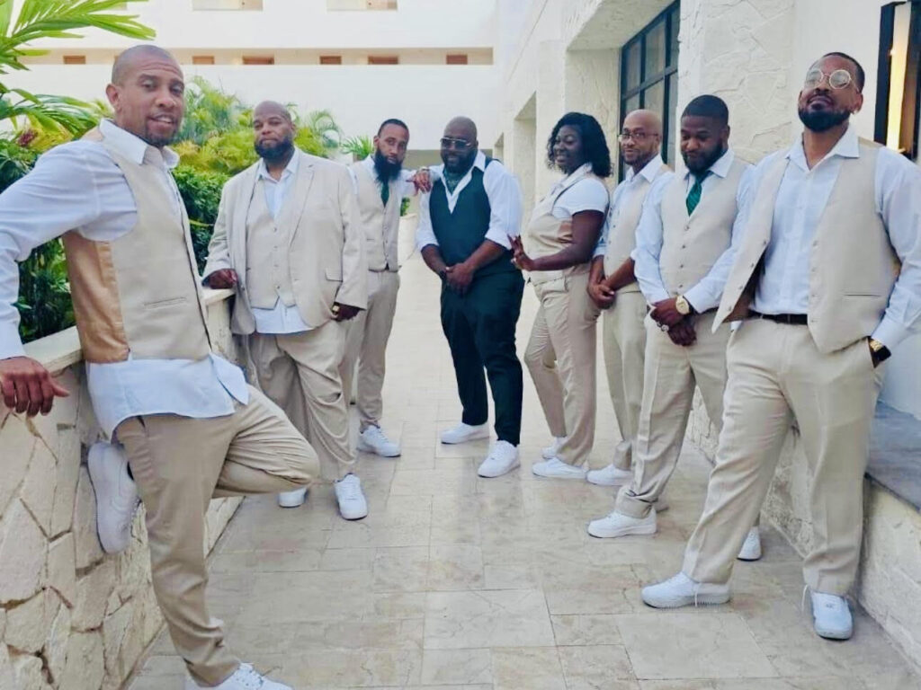 The destination wedding bridal party on the steps at Dreams Natura Resort & Spa in Riviera Cancun, Mexico