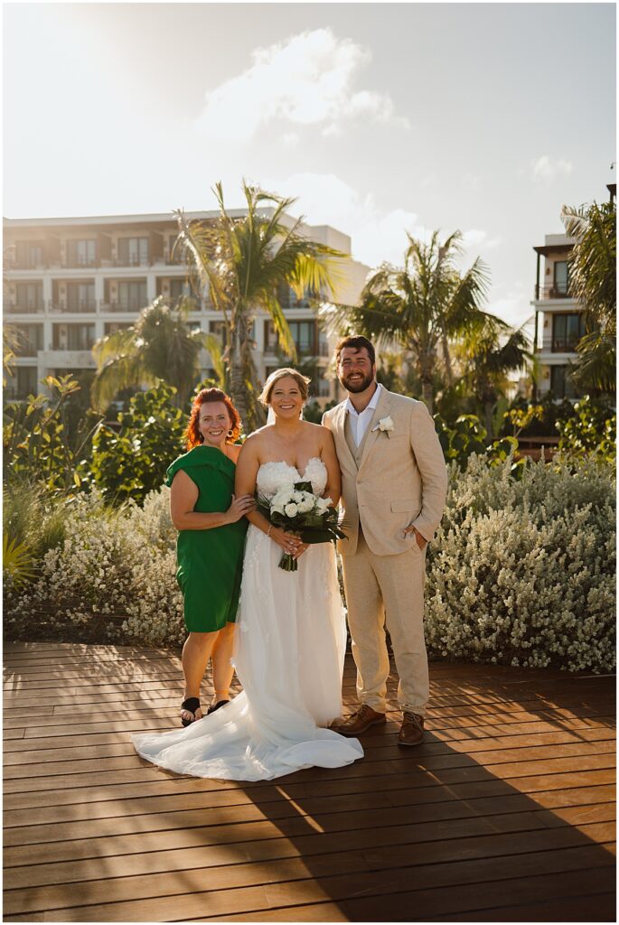 Destination wedding planner, Melissa Esposito with the wedding couple at Secrets Playa Blanca.