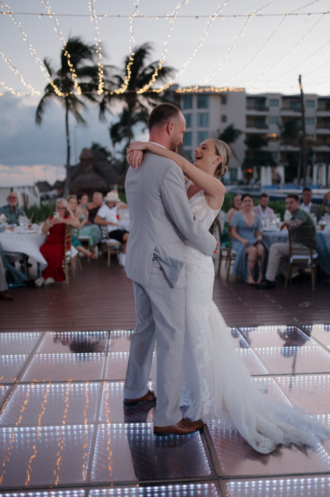 Bride and groom dancing at wedding reception at an all-inclusive resort in Mexico